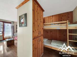 This charming property features a cozy bunk bed area, perfect for accommodating guests or family.