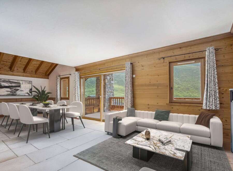 Experience luxury living in this stunning property, featuring a spacious living area with a modern white sofa and a cozy fireplace.