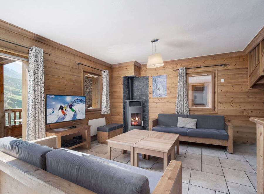Experience the charm of this cozy living space, perfect for a mountain retreat.