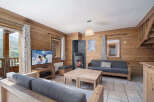 Experience the charm of this cozy living space, perfect for a mountain retreat.