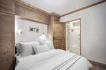 This charming bedroom features a cozy and inviting atmosphere, perfect for a relaxing retreat.
