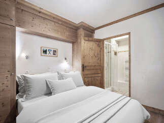 This charming bedroom features a cozy and inviting atmosphere, perfect for a relaxing retreat.