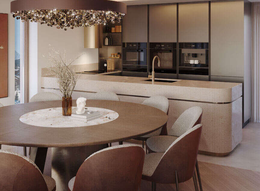 This stunning kitchen and dining area boasts a modern design with high-end finishes.