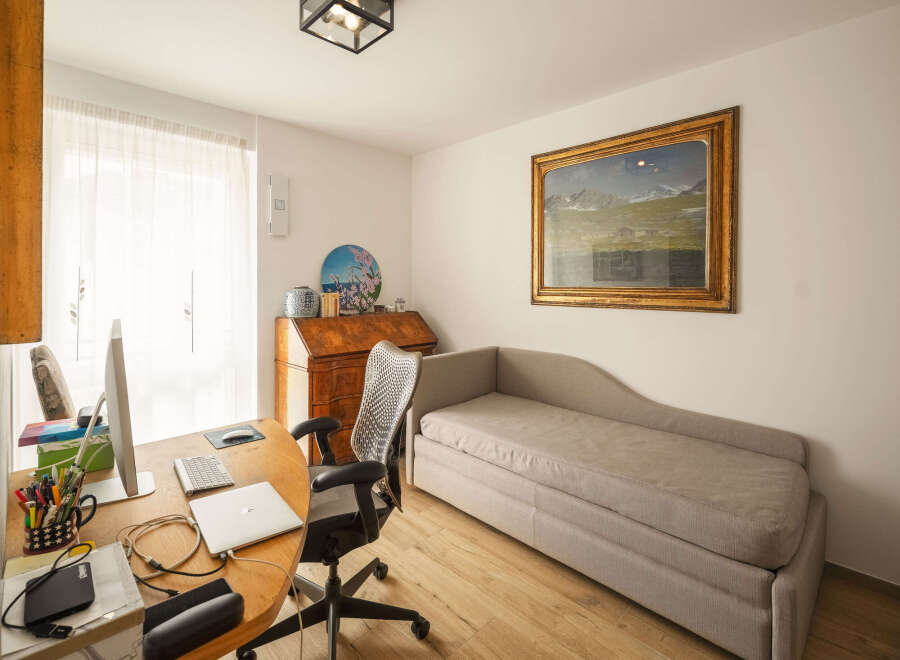 This inviting home office offers a blend of comfort and functionality.