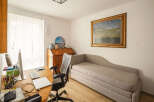 This inviting home office offers a blend of comfort and functionality.