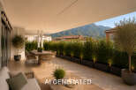 Experience luxurious outdoor living on this expansive terrace, perfect for al fresco dining and relaxation.