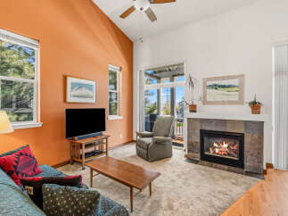 This inviting living room features a cozy fireplace, perfect for chilly evenings.
