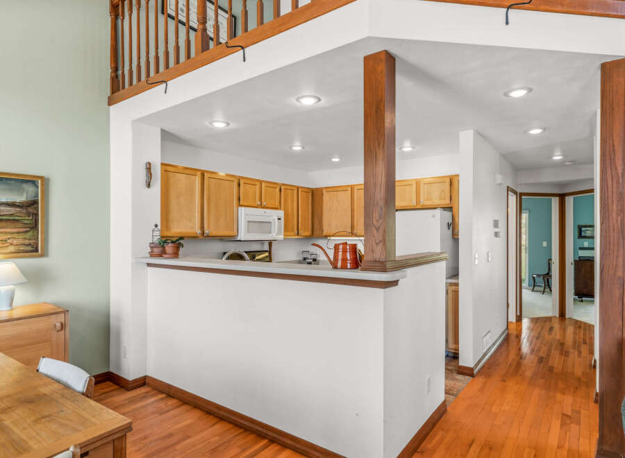Step into this inviting home featuring a well-designed kitchen with ample cabinet space and modern appliances.