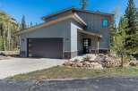 This stunning modern home boasts a sleek design and inviting curb appeal.
