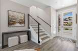 Step into modern elegance with this stunning property! Featuring a sleek staircase with a contemporary cable railing, this home exudes sophistication.