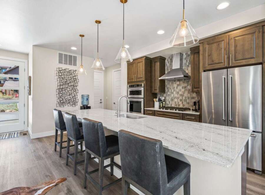 This stunning kitchen boasts a modern design with a spacious island, perfect for entertaining.