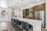 This stunning kitchen boasts a modern design with a spacious island, perfect for entertaining.