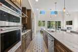 Step into luxury with this stunning kitchen! Featuring stainless steel appliances, a spacious island, and elegant cabinetry, this kitchen is a chef's dream.
