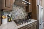This stunning kitchen boasts modern design and high-end appliances.