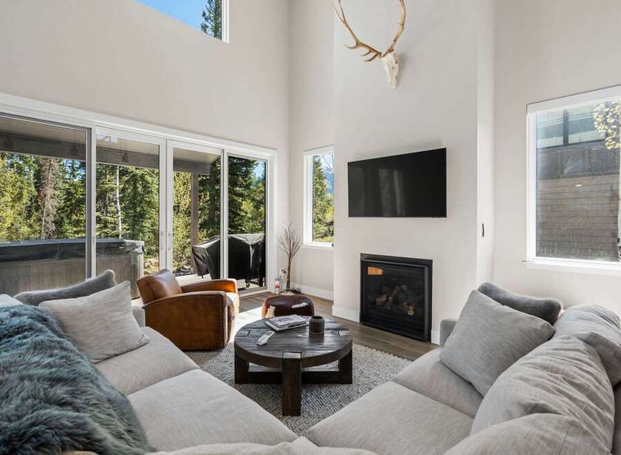 This stunning living room boasts a modern design with a cozy atmosphere.