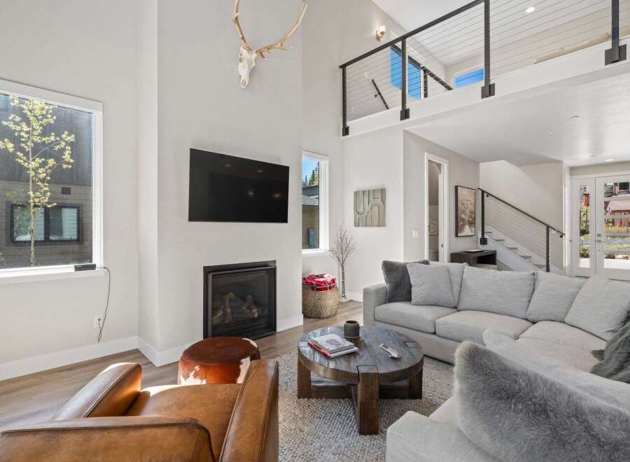 This stunning living room boasts a modern fireplace, perfect for cozy evenings.