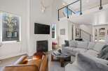This stunning living room boasts a modern fireplace, perfect for cozy evenings.