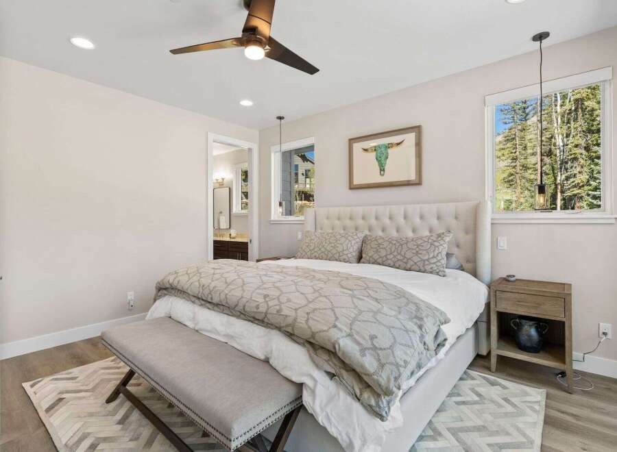 Step into this beautifully designed bedroom, featuring a plush bed, stylish decor, and ample natural light.