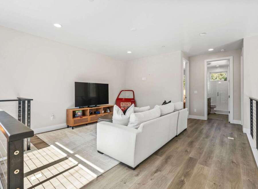Step into modern living with this stunning property, featuring a spacious living room perfect for entertaining.