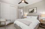 Step into this inviting bedroom, featuring a serene ambiance and modern design.