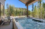 Relax and unwind in this stunning property featuring a luxurious hot tub, perfect for enjoying the breathtaking mountain views.
