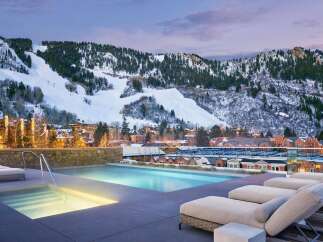 Experience luxury living with this stunning property featuring a rooftop pool and breathtaking mountain views.