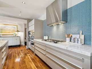 This stunning kitchen boasts modern design and high-end finishes.