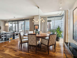Experience luxury living in this stunning property, featuring a beautifully designed dining area.