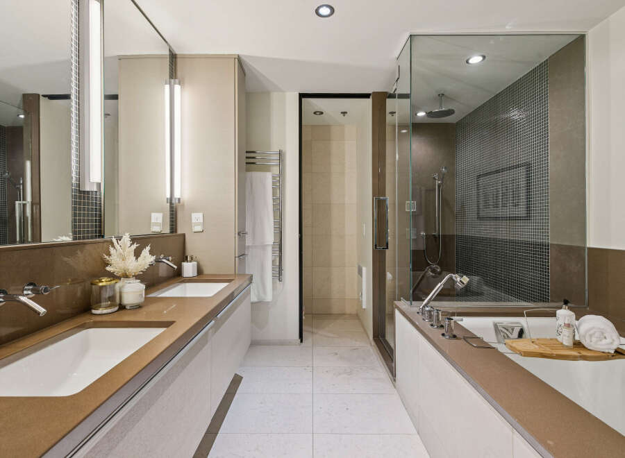 Step into luxury with this stunning bathroom featuring a sleek design and modern amenities.