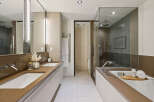 Step into luxury with this stunning bathroom featuring a sleek design and modern amenities.