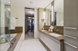 Step into luxury with this stunning bathroom, featuring a sleek design and modern amenities.