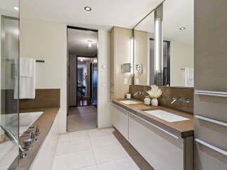 Step into luxury with this stunning bathroom, featuring a sleek design and modern amenities.