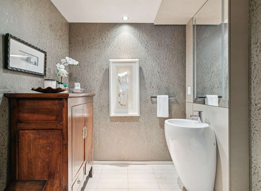 This stunning bathroom boasts a modern design with a touch of elegance.