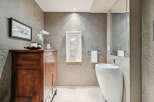 This stunning bathroom boasts a modern design with a touch of elegance.