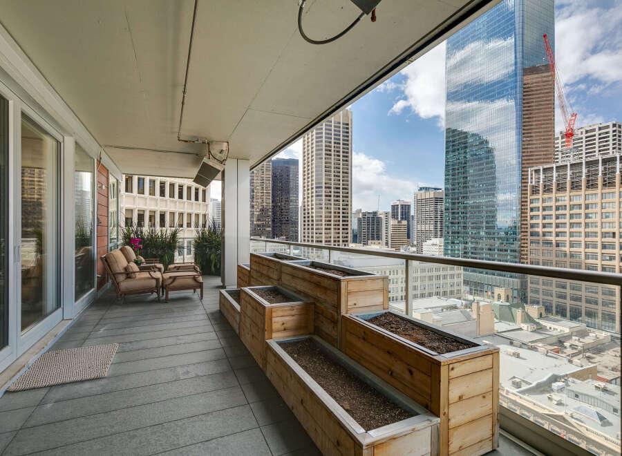 Enjoy breathtaking city views from this stunning balcony.