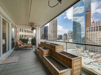 Enjoy breathtaking city views from this stunning balcony.