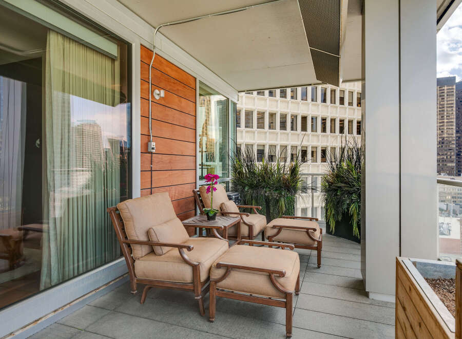 Enjoy breathtaking city views from this stunning balcony.