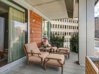 Enjoy breathtaking city views from this stunning balcony.