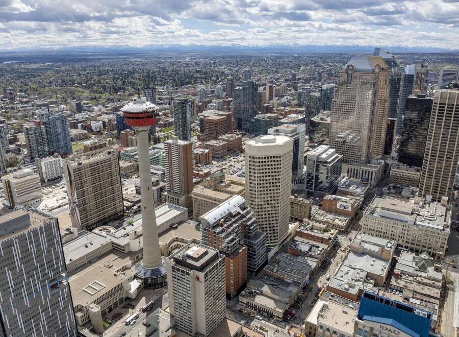 Experience the vibrant energy of downtown Calgary from above! This stunning aerial view showcases a modern cityscape with impressive skyscrapers, including the iconic Calgary Tower.