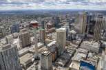 Experience the vibrant energy of downtown Calgary from above! This stunning aerial view showcases a modern cityscape with impressive skyscrapers, including the iconic Calgary Tower.