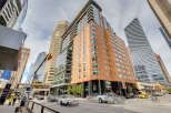 This stunning urban property boasts a modern architectural design with a blend of glass and wood facade.