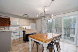 Step into this inviting kitchen and dining area, perfect for both everyday living and entertaining.