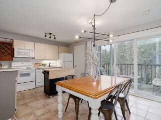 Step into this inviting kitchen and dining area, perfect for both everyday living and entertaining.