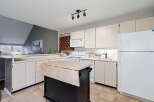 This charming kitchen boasts a functional layout with ample counter space and storage.