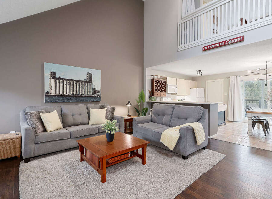 Step into this inviting living space, perfect for relaxation and entertaining.
