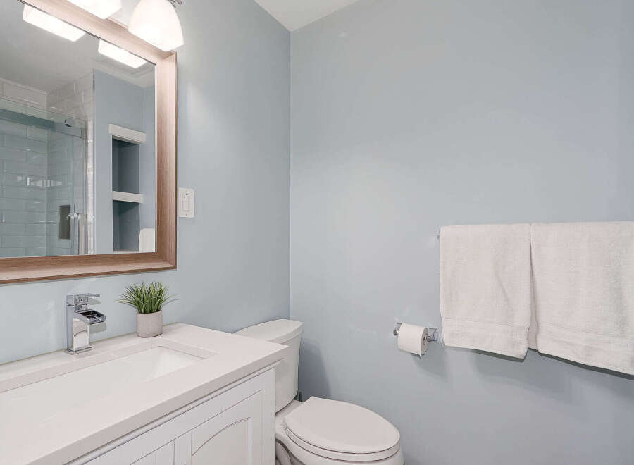 Step into this beautifully designed bathroom, featuring a modern vanity and a sleek, integrated sink.