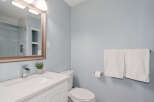 Step into this beautifully designed bathroom, featuring a modern vanity and a sleek, integrated sink.