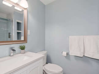 Step into this beautifully designed bathroom, featuring a modern vanity and a sleek, integrated sink.