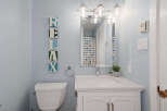 This charming bathroom features a bright and airy design, perfect for relaxation.