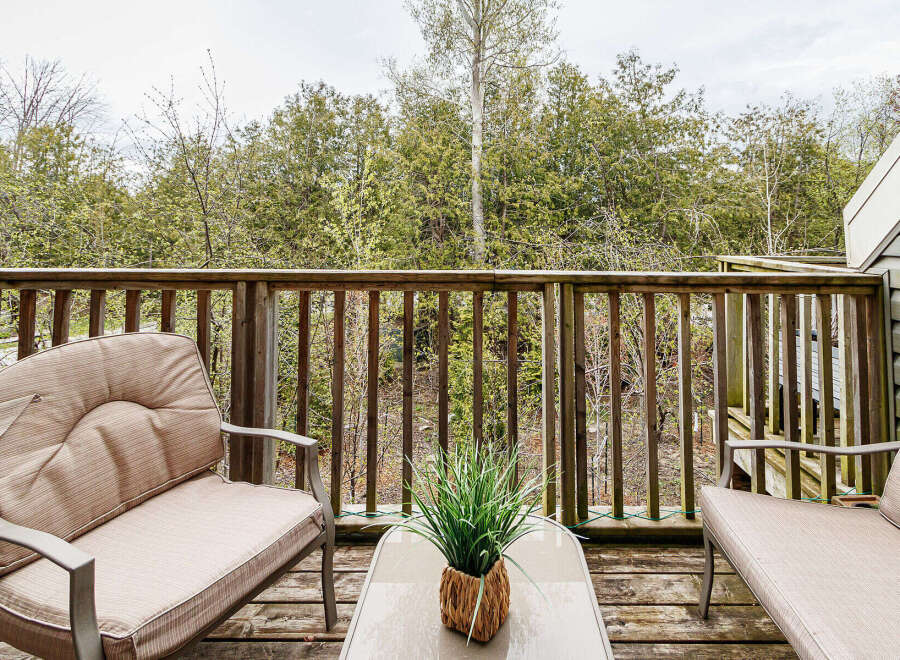 Enjoy the tranquility of nature from this charming outdoor space.